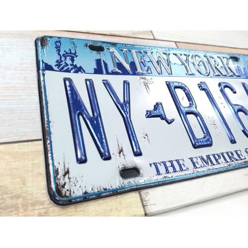 �A�[�g�{�[�h�X�e�b�J�@�i���o�[�v���[�g